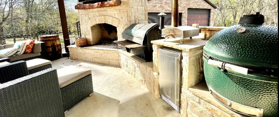 A fireplace and outdoor kitchen for a pavilion space in North Texas.