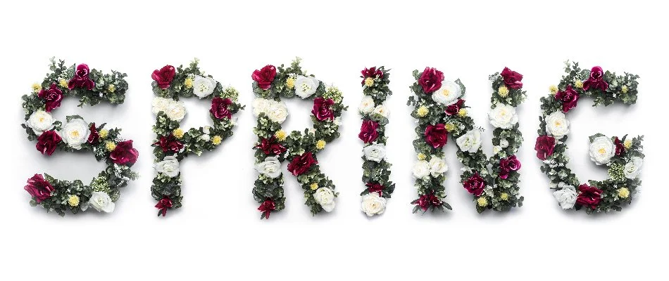 Spring word made out of flowers. 